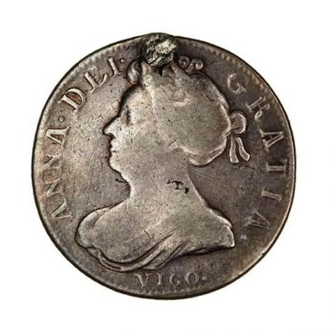 Queen Anne was so pleased with the victory that she had a special series of coins minted out of the captured Spanish silver with ‘Vigo’ written across the bottom. Queen Anne was so pleased with the victory that she had a special series of coins minted out of the captured Spanish silver with ‘Vigo’ written across the bottom. | Vigo Coin, photo courtesy of Peter Daniel.