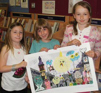 Chatterbooks14 Three children hold up a piece of artwork.