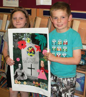 Chatterbooks16 Two children hold up a picture of a grave, augmented by additional artwork.