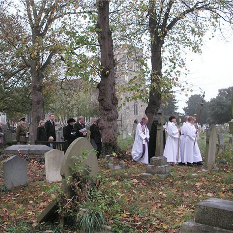 Friday11November-4 The Clergy from St Paulinus Church leading the procession to Private William Whites graveyard for the 2 minute silence.