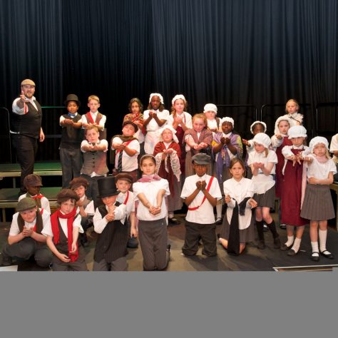 Haberdashers_performance Haberdashers performance. Schoolchildren on stage.