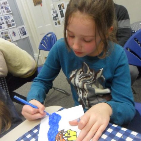 Student helping make props for the animated film set.